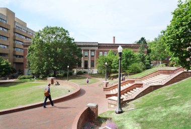 RALEIGH,NC/USA - 4-25-2019: Students walking on the campus of No clipart