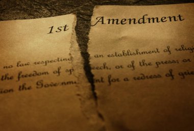 The First Amendment of the US Constitution, torn in half. Civil rights concept                         clipart