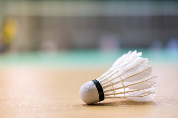 Shuttlecock put on floor badminton court - for sport background or texture.