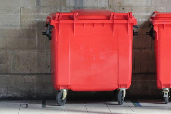 Red waste containers aka Litter bin garbage bin trash bin or waste bin