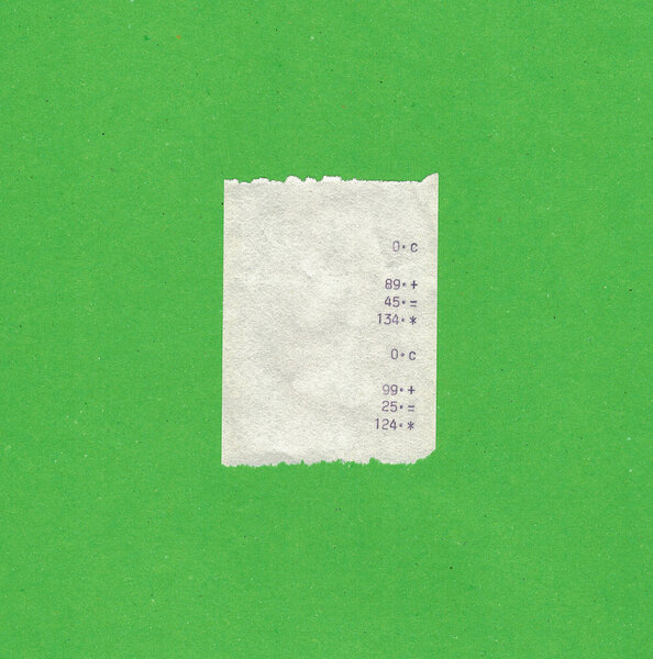 Bill or receipt isolated over green background