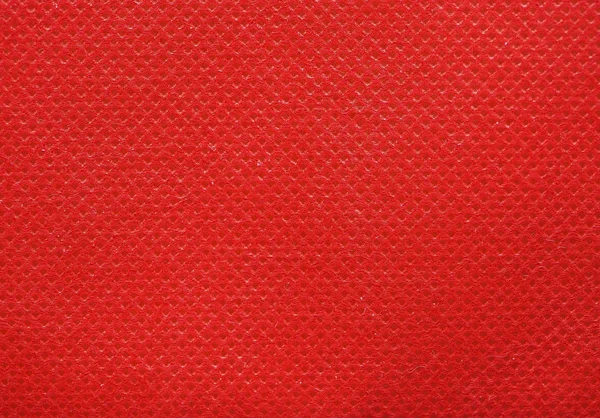 Rode vlies polypropyleen stof textuur achtergrond — Stockfoto