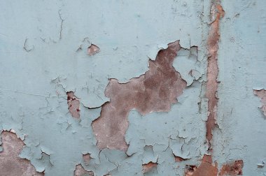 mavi boya kalıntıları ile eski püskü duvar