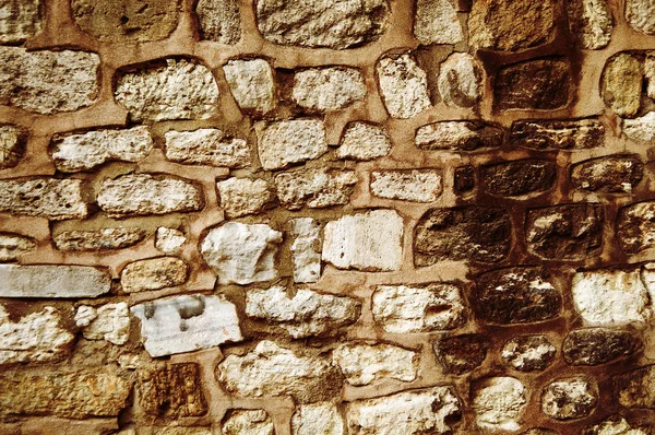 古い石造りの壁テクスチャ テキストやイメージのオレンジ色で — ストック写真