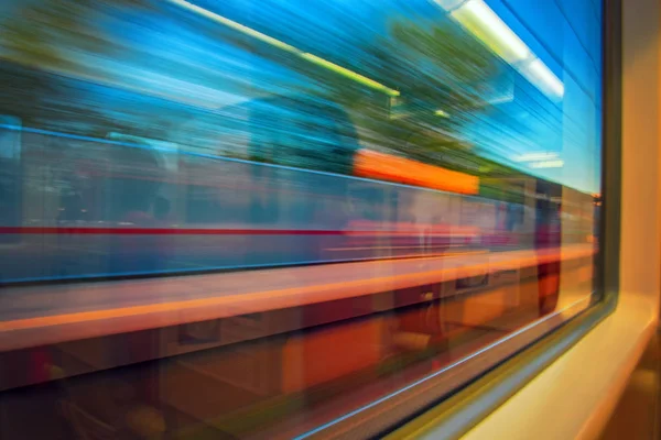 Abstract motion-blurred view from fast moving high speed train. Motion blur view from the window  train. Concept traveling by rail Stock Picture