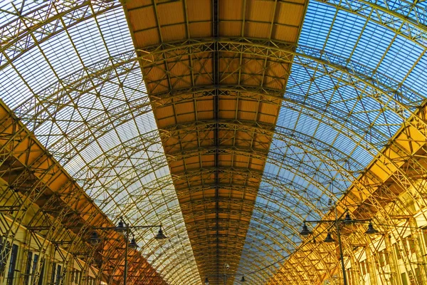 Train Station. Transparent roof railway station bottom view.  Metal roof construction, cellular honeycomb structure,