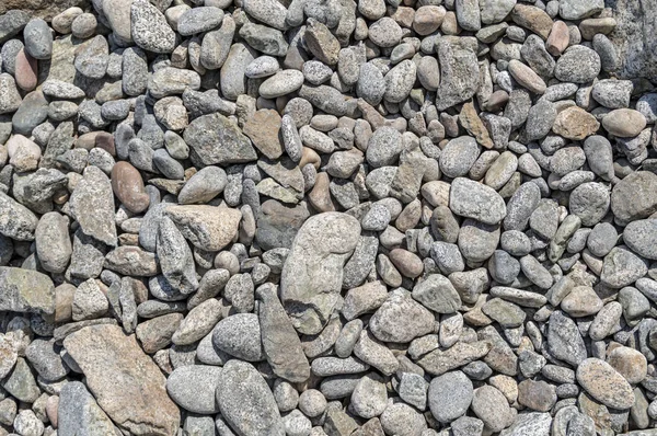 Pürüzsüz dokuya sahip gri taşlar. Soyut sanat desen arka plan. Okyanus kıyısı, arka plan duvar kağıdı. Deniz çakıl dekorasyon.