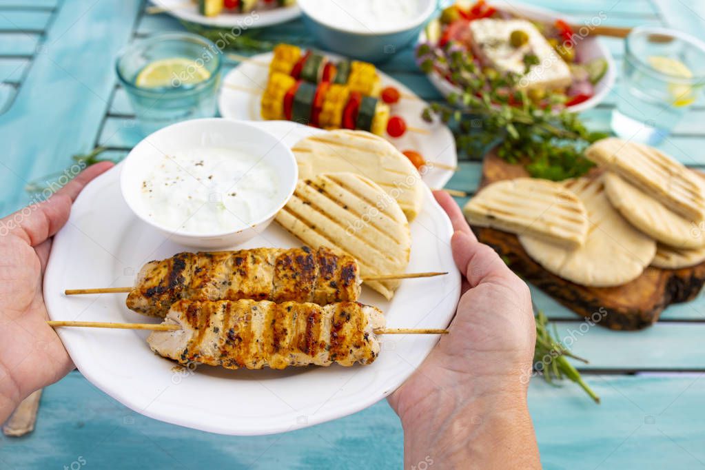 Delicious grilled chicken souvlaki, traditional Greek dish.