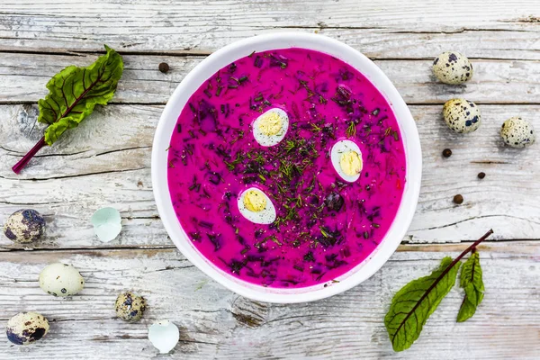 Cold soup with beetroot and quail eggs on wooden table. — Stock Image Cold Soup Beetroot Quail Eggs Wooden Table Stock Picture