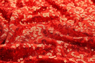 Arka plan doku, desen. İle kumaş kırmızı bordo. Bu Neon pembe birleşiyor payetler bak. Yuvarlak neon pembe birleşiyor payetler yanardöner bir sheen ile şeffaf mor bir kafes arasında örtüşüyor.