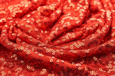 Arka plan doku, desen. İle kumaş kırmızı bordo. Bu Neon pembe birleşiyor payetler bak. Yuvarlak neon pembe birleşiyor payetler yanardöner bir sheen ile şeffaf mor bir kafes arasında örtüşüyor.