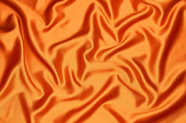 Ярко Оранжевая Шелковая Ткань Переполнена Светлом Фоне Текстуры — стоковое фото