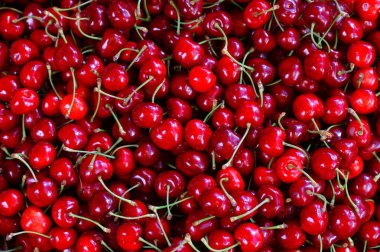 Fresh cherries in the box selling in the market. clipart