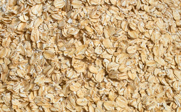 Background texture of crushed seed and grain mix for livestock and bird feed — Stock Photo, Image