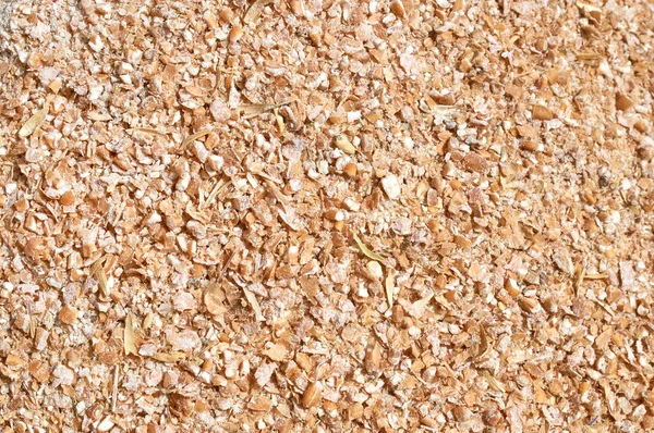 Background texture of crushed seed and grain mix for livestock and bird feed — Stock Photo, Image