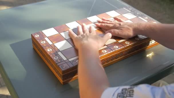 Old Man Opens Chess Game Box Garden Table Puts White — Stock Video