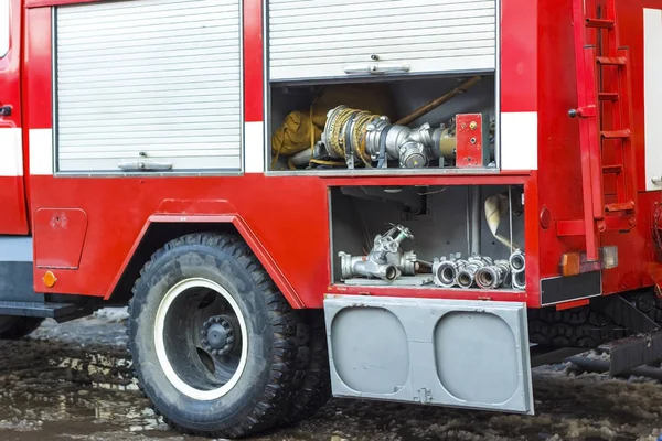 The fire truck is red. Fire and rescue equipment in a fire truck