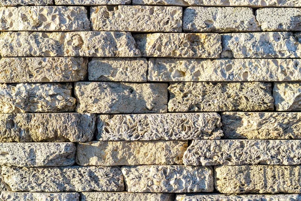 Stenen achtergrond. Achtergrond textuur van een stenen en marmeren muur. Stockafbeelding