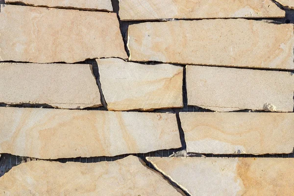 Fragment of a wall made of stone. Stone wall. — Stock Image Fragment of a wall made of stone. Stone wall. Stock Image