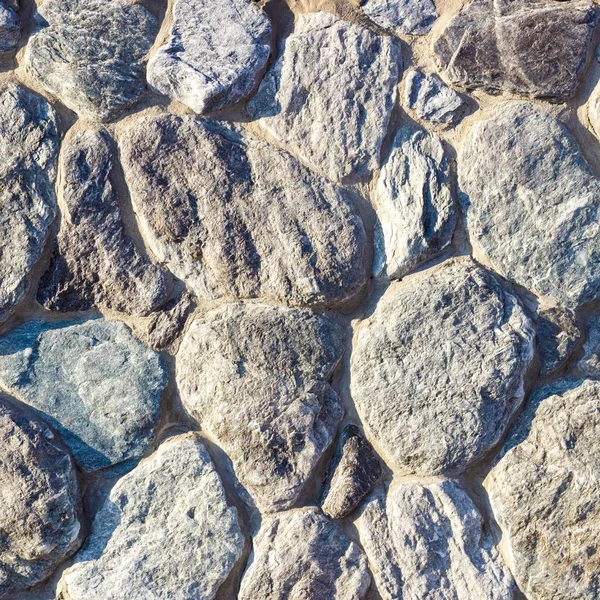 Fragment van een muur gemaakt van steen. Stenen muur. — Stockfoto