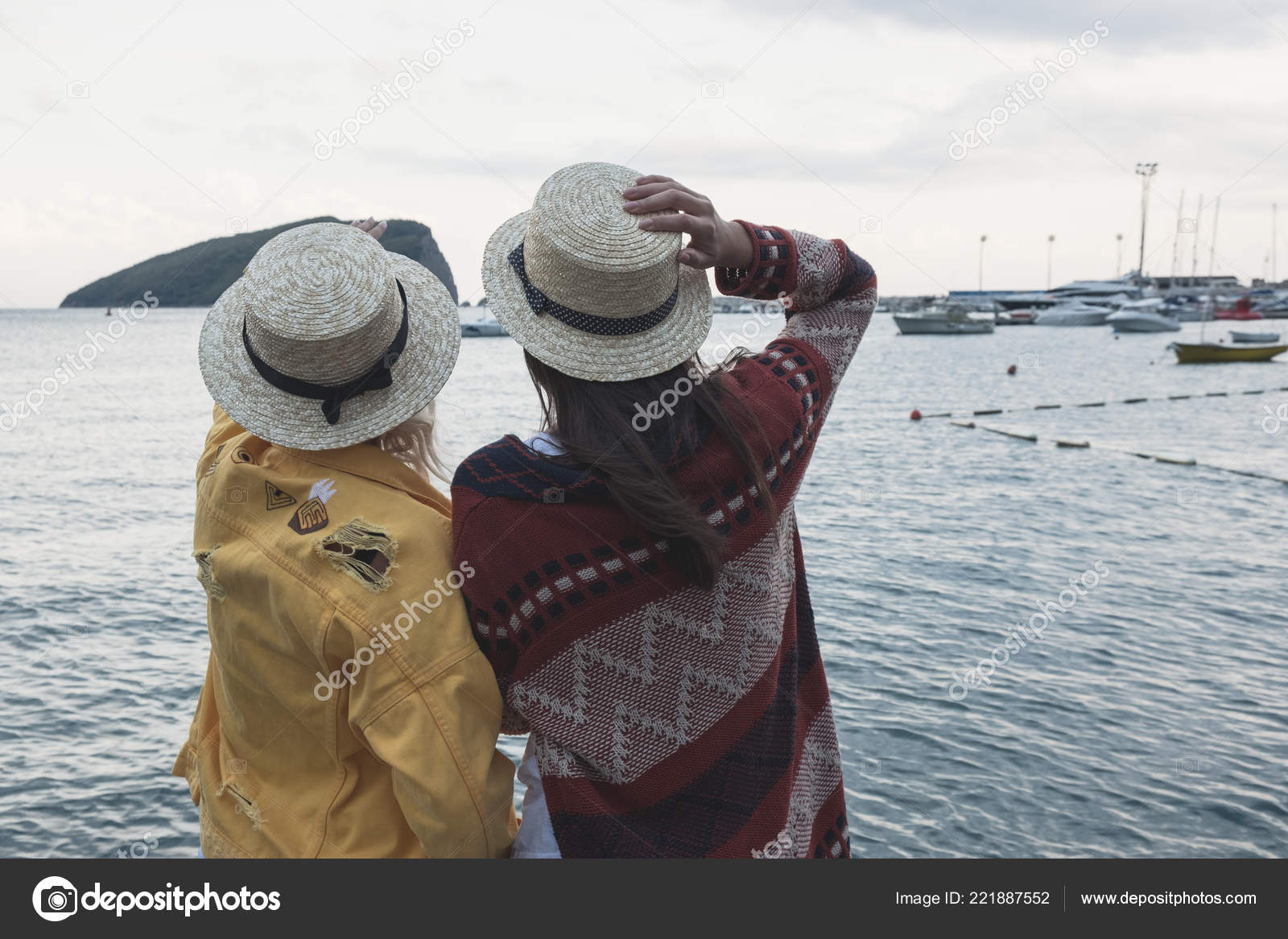 Two Dark Blonde Haired Girls Hats Standing Looking Summer Sea