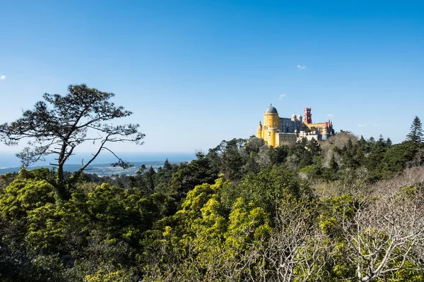 Palace of Pena in Sintra. Lisbon, Portugal. Famous landmark. Summer morning landscape with blue sky. — Stock Photo, Image