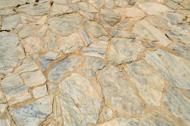 Duvardaki bristchatku kaba eski eski browns cobblestones dikişi ile çeşitli düzensiz taşlarının dokusuna koydu. Arka plan.