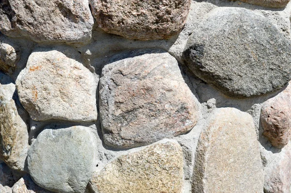 Textura de natural natural esculpido sólido forte áspero áspero afiado texturizado mineral cinza pedra marrom calçada nas paredes da rocha. Fundo de pedra — Fotografia de Stock