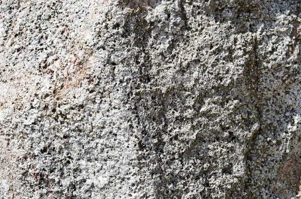 Textura de natural natural esculpido sólido forte áspero áspero afiado texturizado mineral cinza pedra marrom calçada nas paredes da rocha. Fundo de pedra — Fotografia de Stock