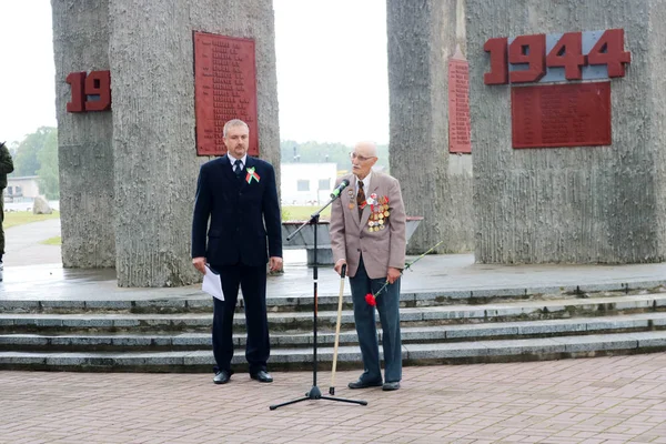 Old man grandfather veteran of World War II in medals and decorations stands next to the monument on the day of victory Moscow, Russia, 05.09.2018 Stock Picture