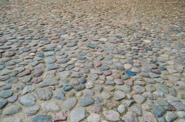 Taş yol, kaldırım, büyük gri eski Ortaçağ surlarının dokusuna güçlü taş, cobblestones yuvarlak. Arka plan