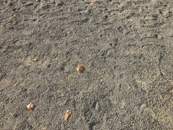 Tekstury szary suchej ziemi, piasku z dużych kamyków. Tle — Zdjęcie stockowe