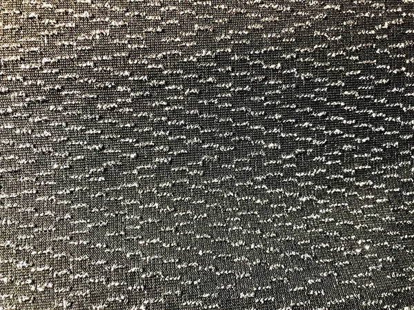 Texture di tessuto sintetico nero con bellissimi puntini argentei scintilla. Lo sfondo — Foto Stock