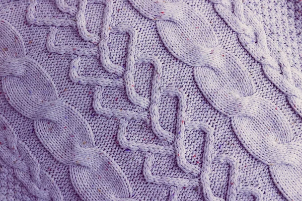 Mooi patroon van een zachte warme natuurlijke trui met een gebreide patroon van draden. De achtergrond — Stockfoto