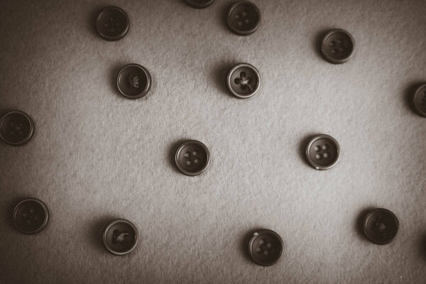 Beautiful black and white texture with a lot of round buttons for sewing, needlework. Copy space. Flat lay. The background