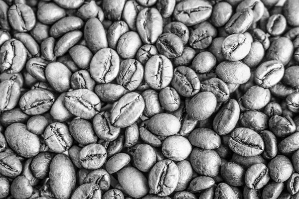 Beautiful texture of freshly roasted selected delicious rich brown natural fragrant coffee tree grains, Arabica coffee beans, Robusta. Flat lay and copy space. The background — Stock Photo, Image