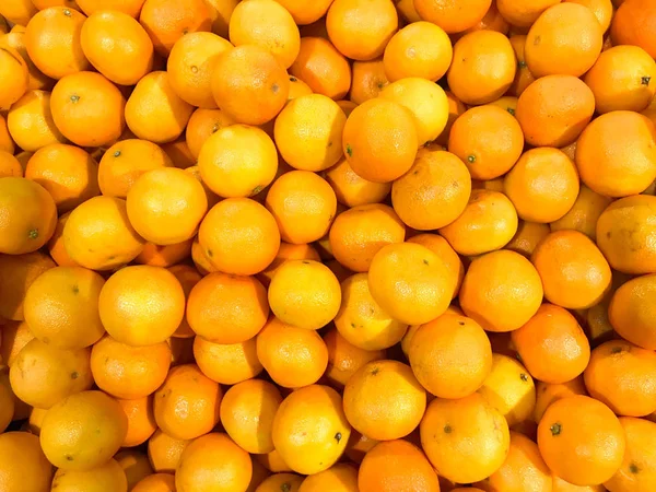 Beautiful yellow natural sweet tasty ripe soft round bright bright tangerines, fruits, clementines. Texture, background — Stock Photo, Image