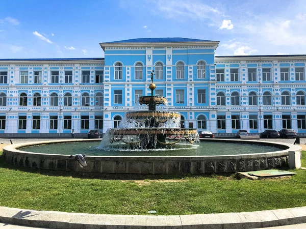 The blue beautiful building of the state university of Batumi and the fountain in front of it. Batumi, Georgia, April 17, 2019 — Stock Photo, Image