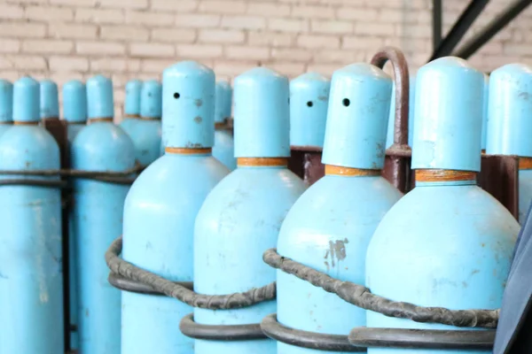 Large iron metal blue gas cylinders with oxygen, air, helium und — Stock Photo, Image