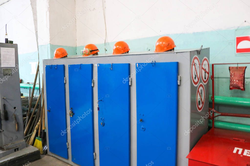 Large blue metal iron workwear lockers with protective building 