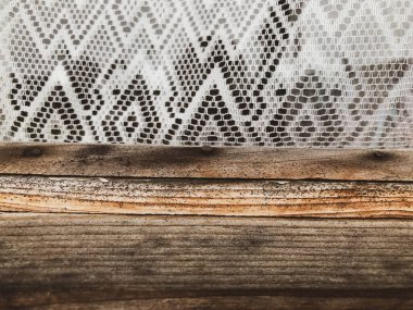 wood texture. wooden house. wood brown, voluminous, textured, cracked. next to the wooden strip is a white patterned tulle. patterned apron. wooden house window clipart