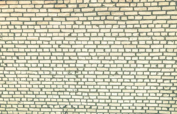 Weiße Ziegelmauer. Textur aus kleinen, gebleichten Betonsteinen. Grafische Dekoration der Hauswand. stylisches Design Renovierung. lackierte Oberfläche — Stockfoto