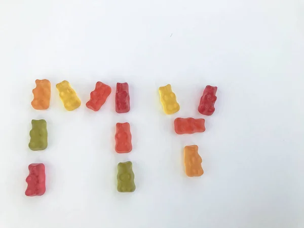 gelatinous, multi-colored, voluminous bears in the form of the word MY. appetizing, sweet, edible candy lettering. favorite gummy treats. vitamin natural candies