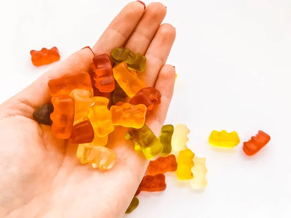 home confectionery. the girl cook has prepared a lot of bright sweet candies. bears from gelatin for buyers. mouth-watering sweets. fruit nectar dessert