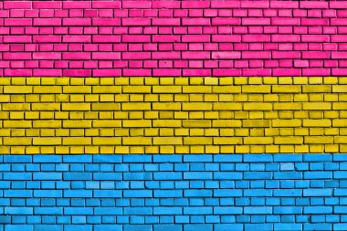 Tuğla duvarda Panseksüel Gurur Bayrağı 