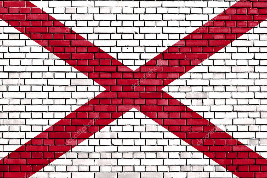 flag of Alabama painted on brick wall