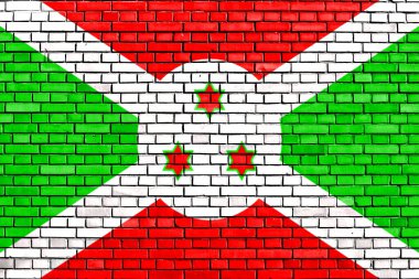 Burundi bayrağı tuğla duvara boyanmış.
