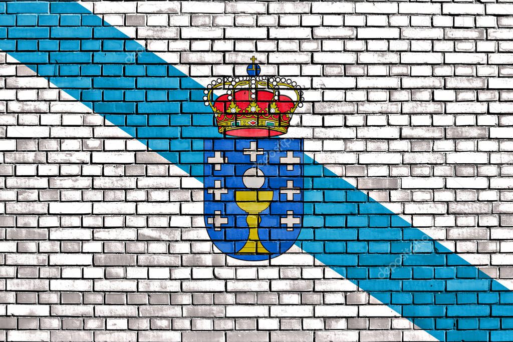flag of Galicia painted on brick wall