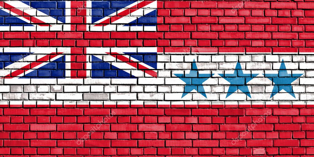 flag of Kingdom of Rarotonga painted on brick wall