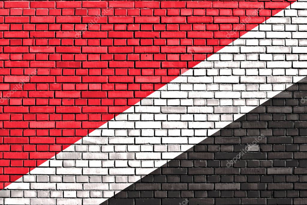 flag of Sealand painted on brick wall